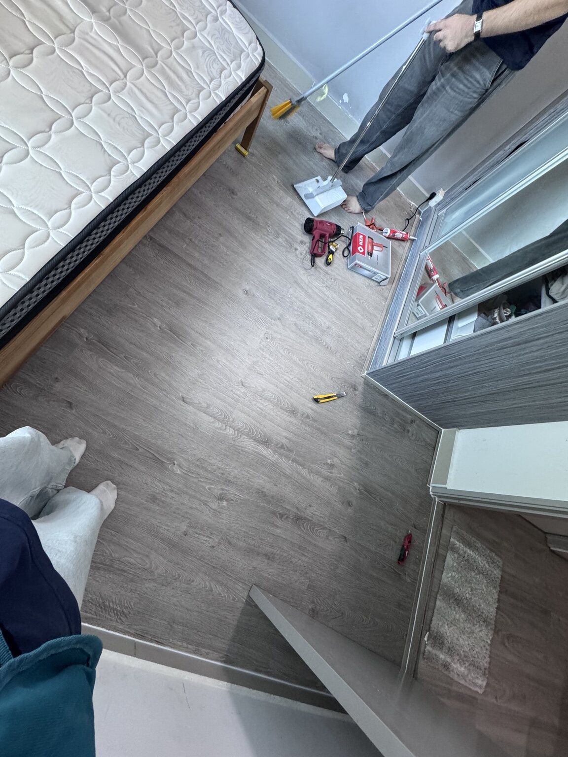SPC flooring installation in a residential bedroom